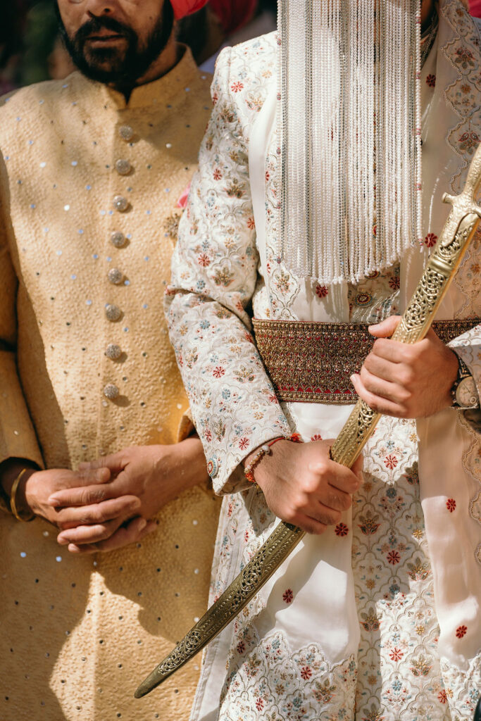 Detailed shot of bride and groom's traditional attire at Rancho Las Lomas wedding.