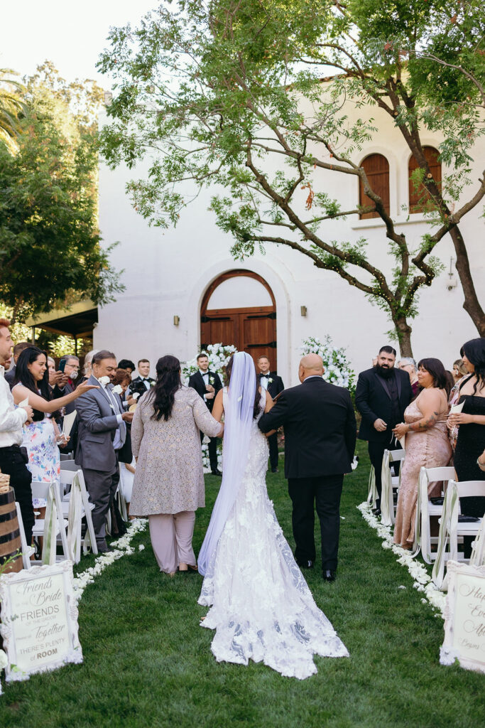 Bride walking down the aisle at Wente Vineyards outdoor wedding ceremony