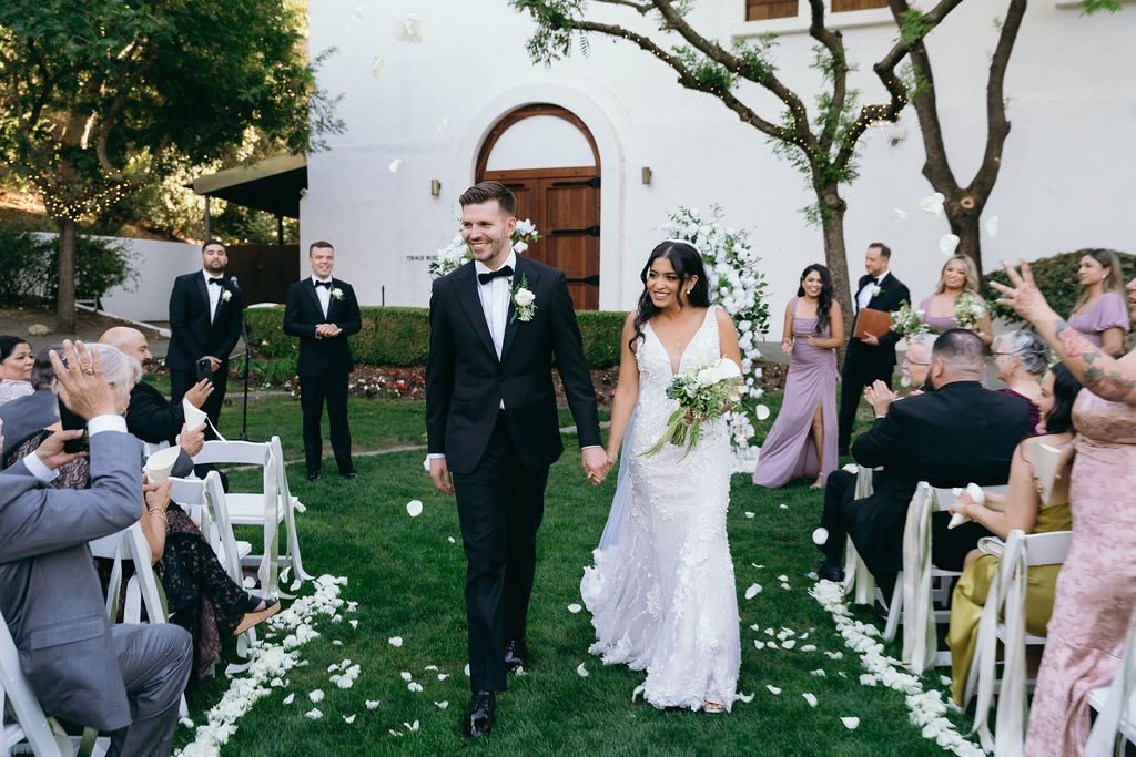 Bride and Groom exiting down the aisle at Wente Vineyards outdoor wedding ceremony