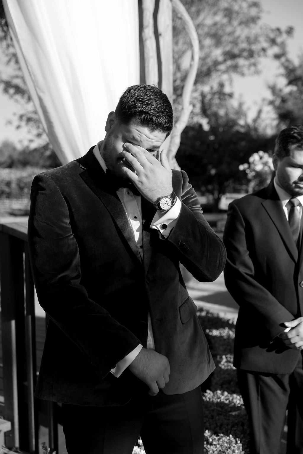 Groom wipes a tear during the ceremony at Wolfe Heights Wedding in Sacramento.