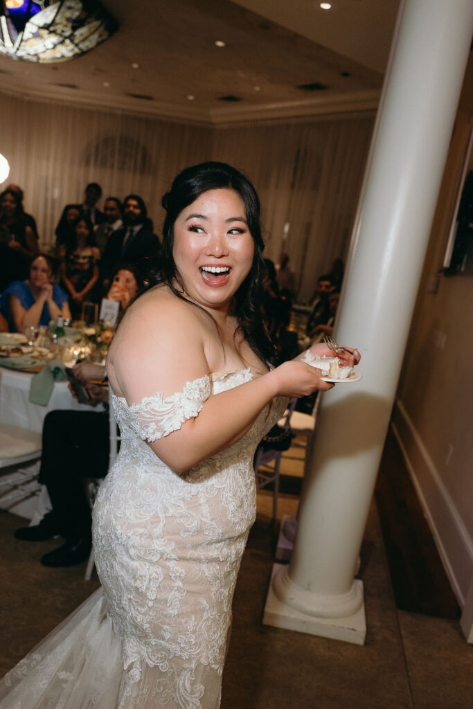 Candid laughter as the bride shares a fun moment with guests on the dance floor