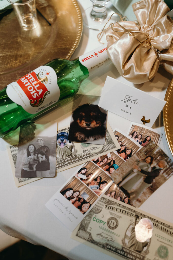 Table details with custom wedding decor, beer bottle, and personalized currency