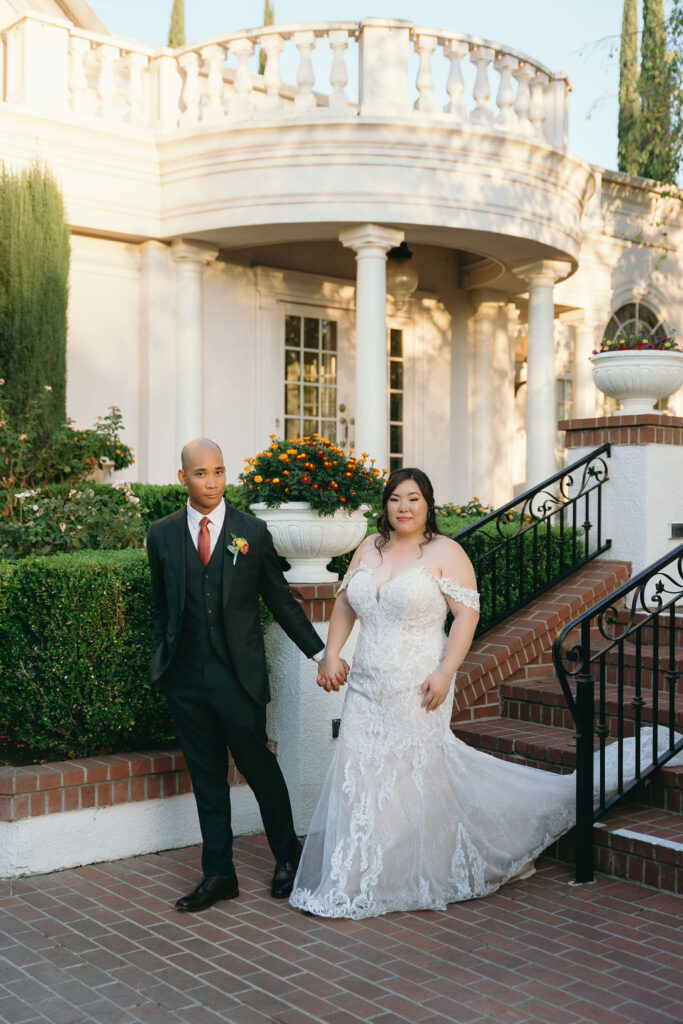 Bride and groom pose in front of Vizcaya Sacramento’s grand fountain, capturing the venue’s timeless elegance