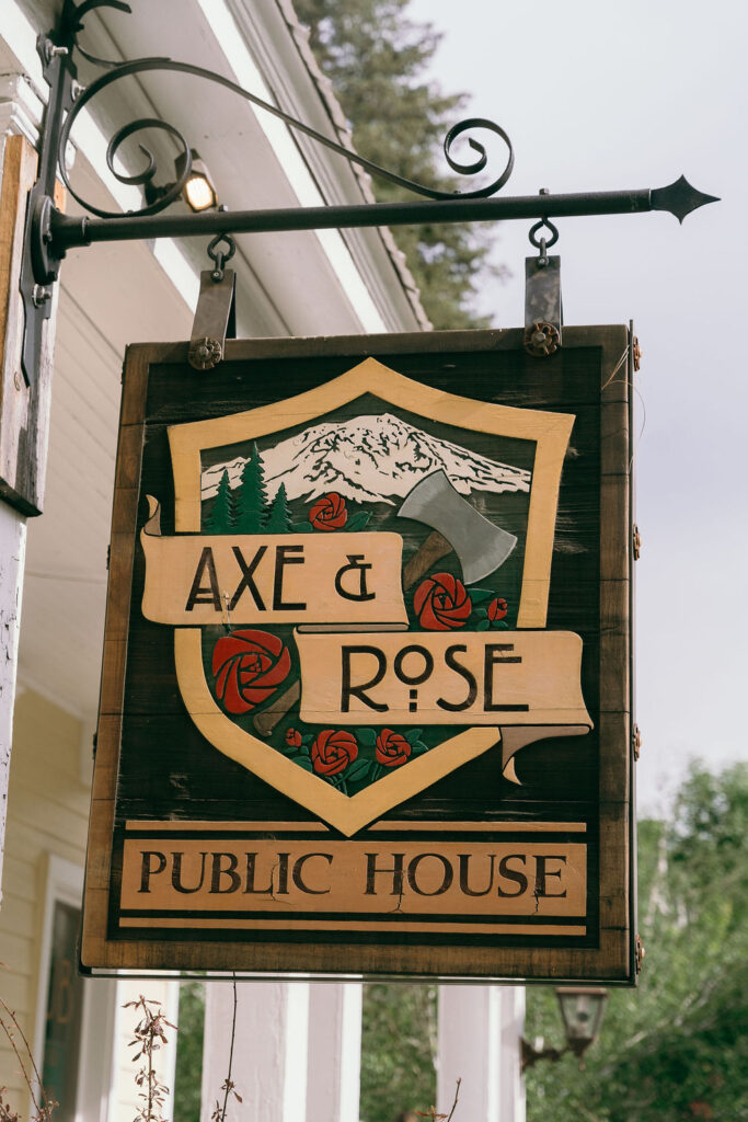 Axe & Rose Restaurant sign at McCloud Hotel. The rustic venue hosted Emily and Matthew’s wedding receptioncaptured by a Northern California Wedding Photographer