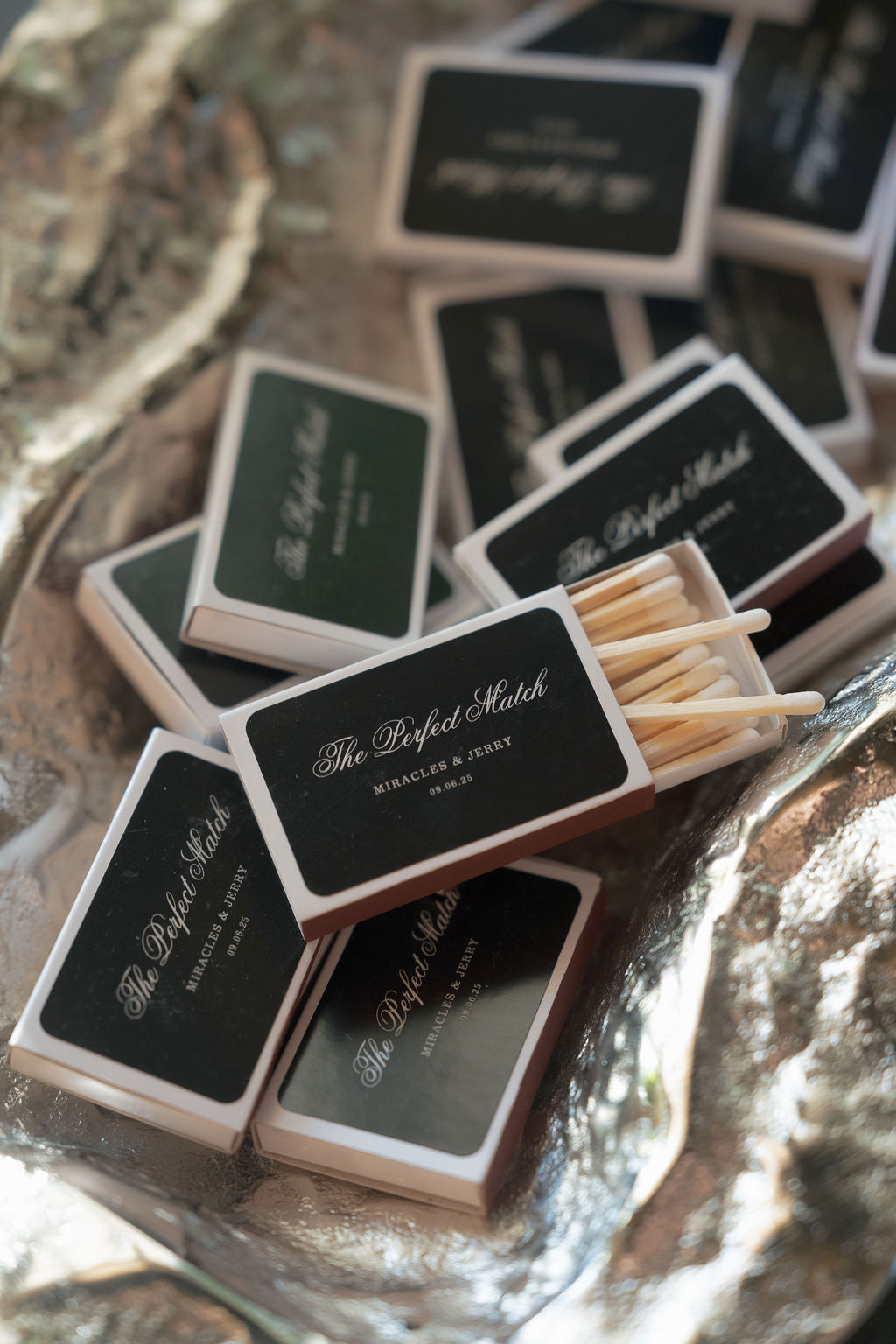 Custom wedding matchbox favors displayed at Grand Island Mansion.