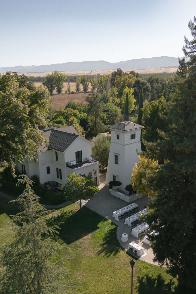 Aerial view of Park Winters wedding estate with outdoor reception tables and surrounding farmland.