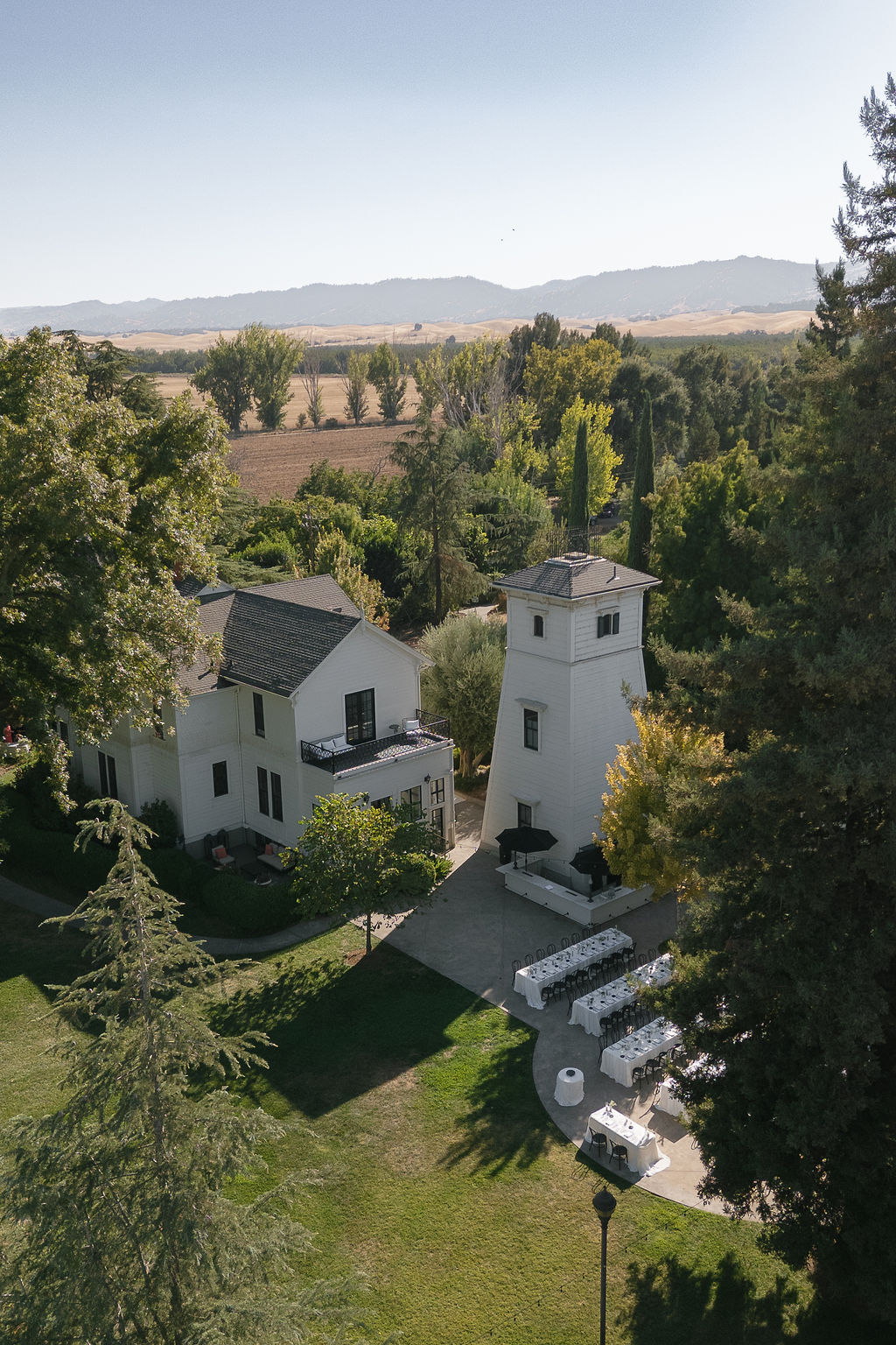 Aerial view of Park Winters wedding estate with outdoor reception tables and surrounding farmland.