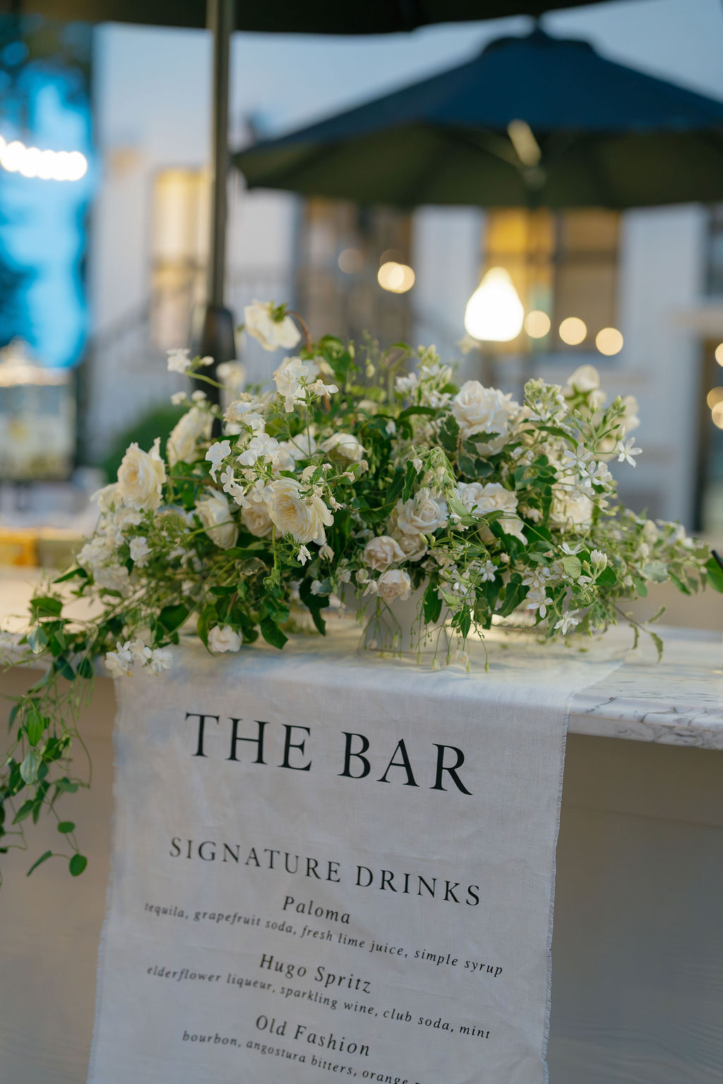Floral bar décor and signature cocktail menu at Park Winters wedding reception.